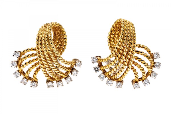 Yellow gold earrings. These classic earrings are a stylish, five row braided fold over knot, decorated on the ends with round faceted, prong set diamonds, approximately 0.50 TCW.